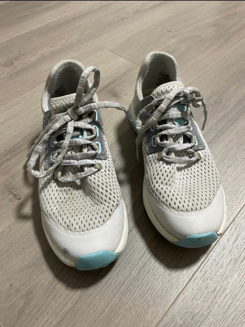 OluKai Women's White Athletic Sneakers with Light Blue Accents